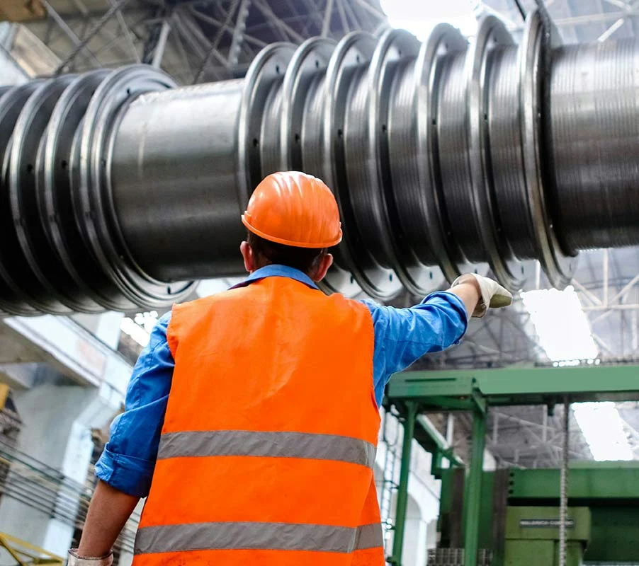 Industrial Worker Inspecting Heavy Machinery Industrial Worker Inspecting Heavy Machinery