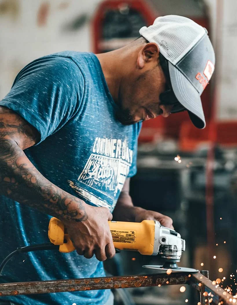 Man Using Angle Grinder Man Using Angle Grinder
